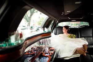 Girl in wedding dress in limo