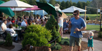 People gather on the outdoor patio of Blue Mountain Brewery in Afton, Va.