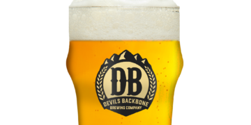 Large glass of beer with the Devils Backbone Brewery logo